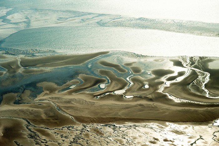 Photo of intertidal area with deeper channels in the Wadden Sea.