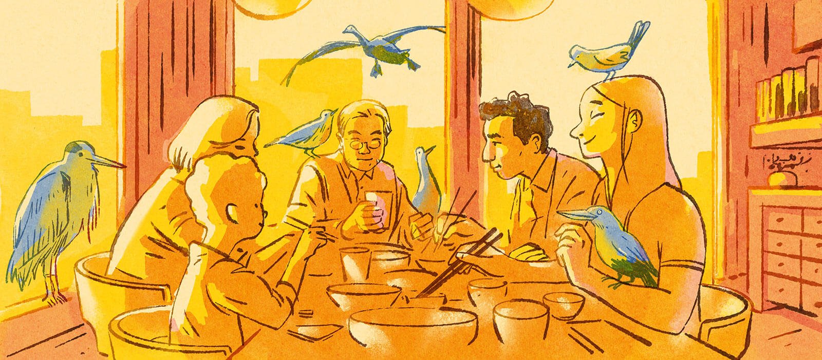 Five members of a multilingual family eating together at the table