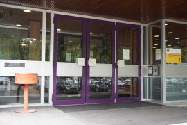 The doors of the main entrance of the Leonard S. Ornstein Laboratory