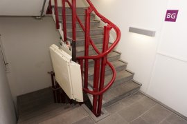 A staircase with staircase elevator (NOT FUNCTIONING) at the Willem C. Schimmel building