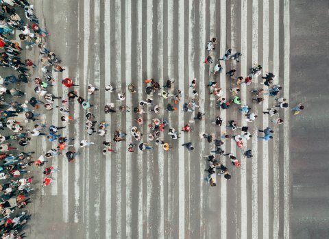 Aerial photo of humans forming an arrow shape