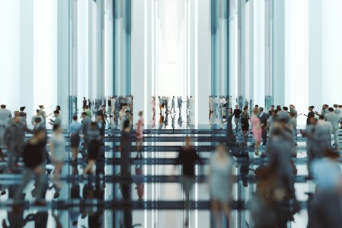 Abstract image of people in a large room