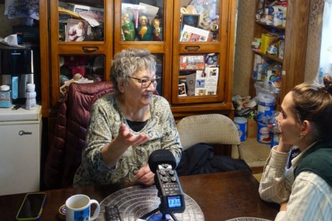 “Silja Zimmermann interviews a St. Paul resident. Photo: Wiebe de Jong”