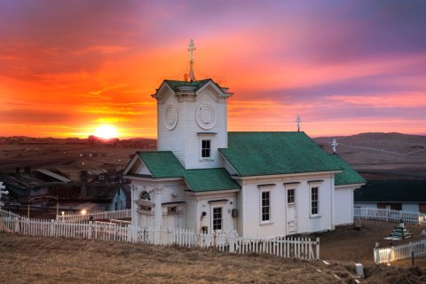 Photo of a church at sunrise on St. Paul Island
