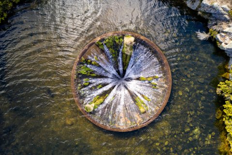 A well in a well - water container in a river