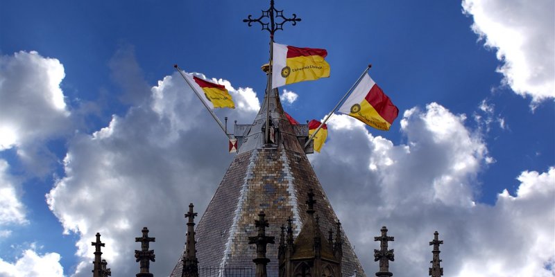 Top of Domtower with flags of Utrecht University